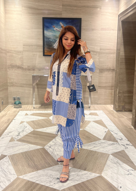 Stylish ethnic fusion outfit for women featuring a printed blue kurta and checkered pants with tie-up details