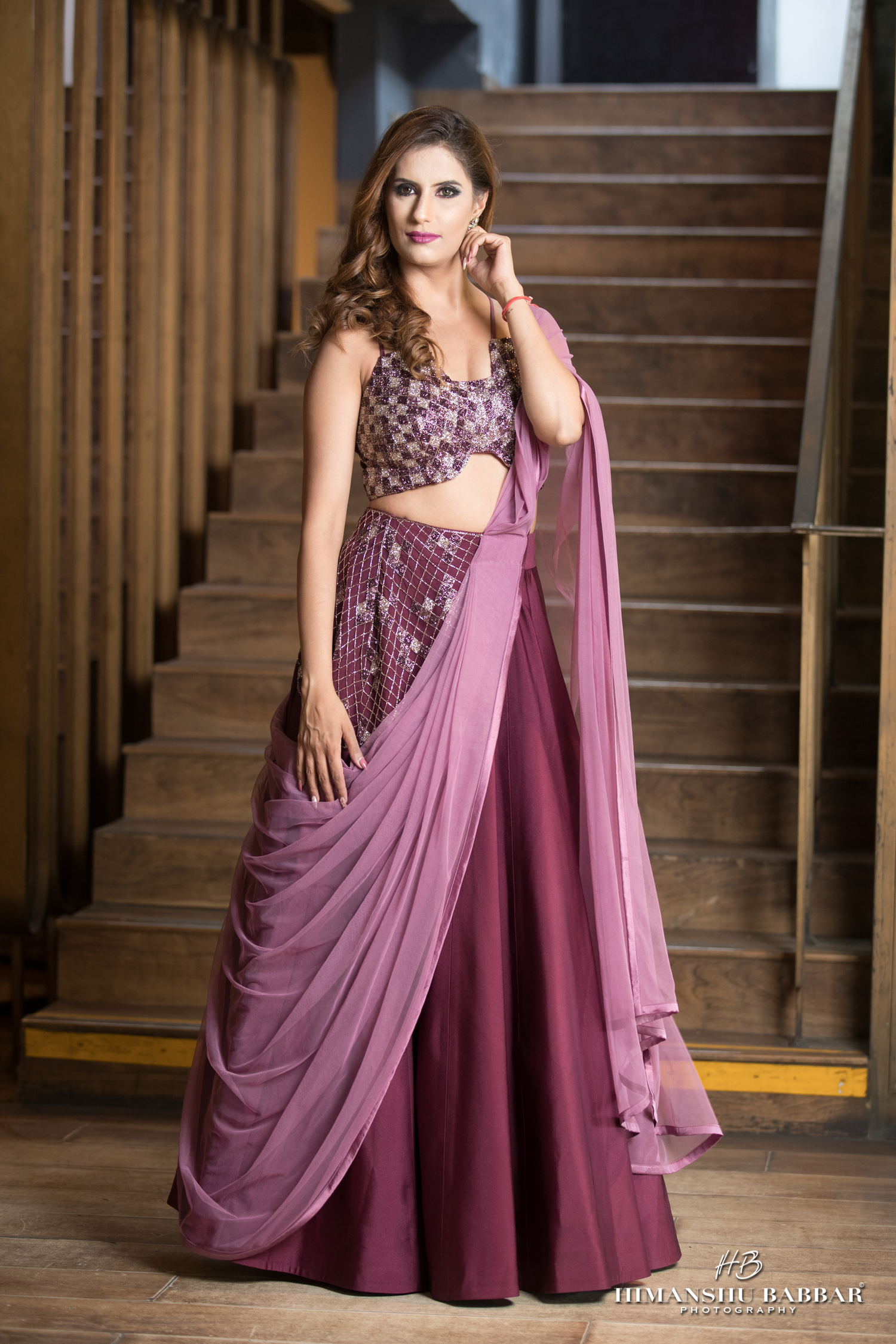 Check hand-embroidered blouse with asymmetrical waist lehenga – modern Indian designer set”