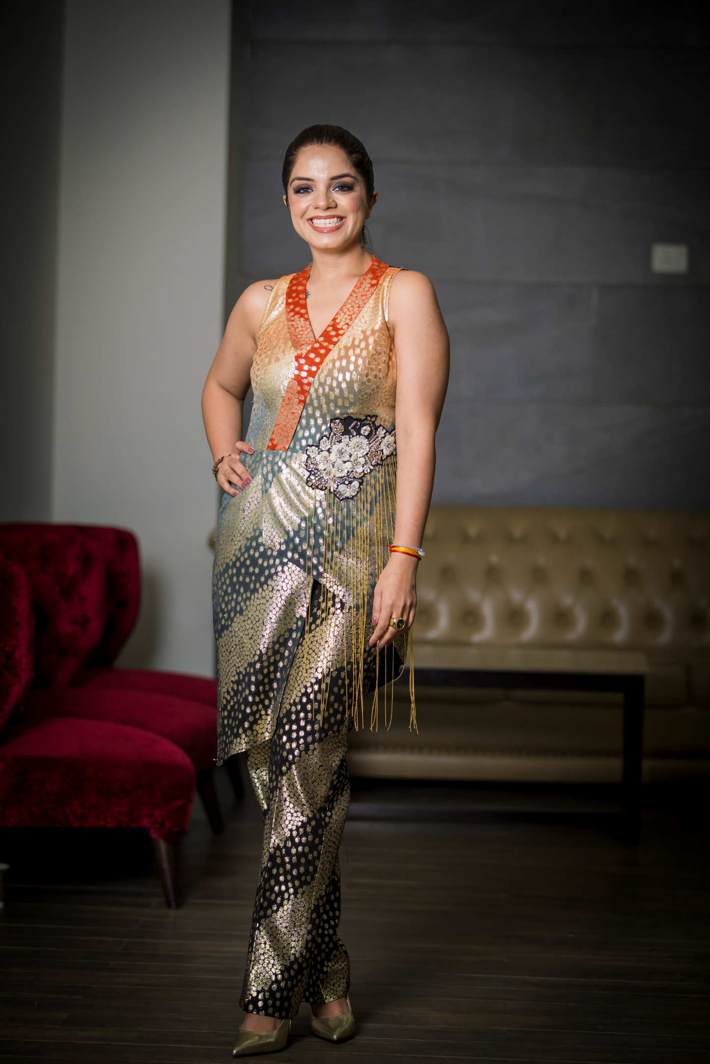 Women’s metallic sari with snake-patterned design and intricate beadwork – bold designer Indian wear