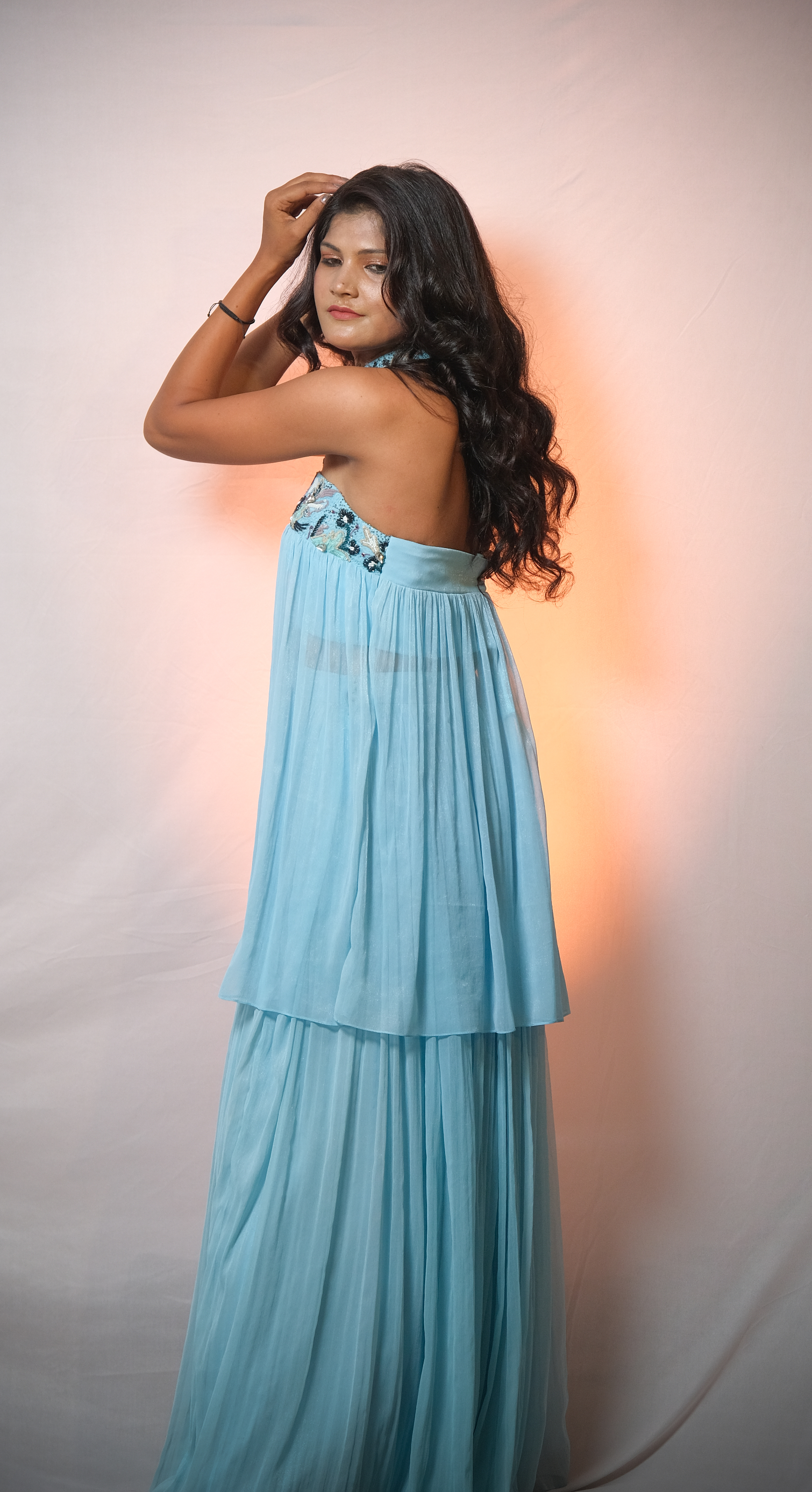 Whimsical sky blue halter ensemble with embroidered floral accents – elegant summer outfit for women