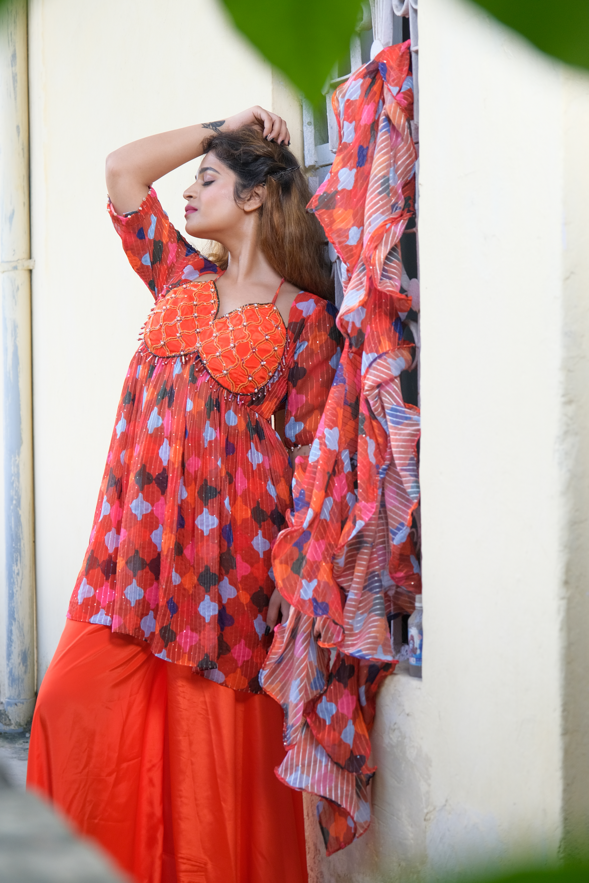 Vibrant orange cape-style top with geometric print and matching palazzo pants – modern ethnic co-ord for women