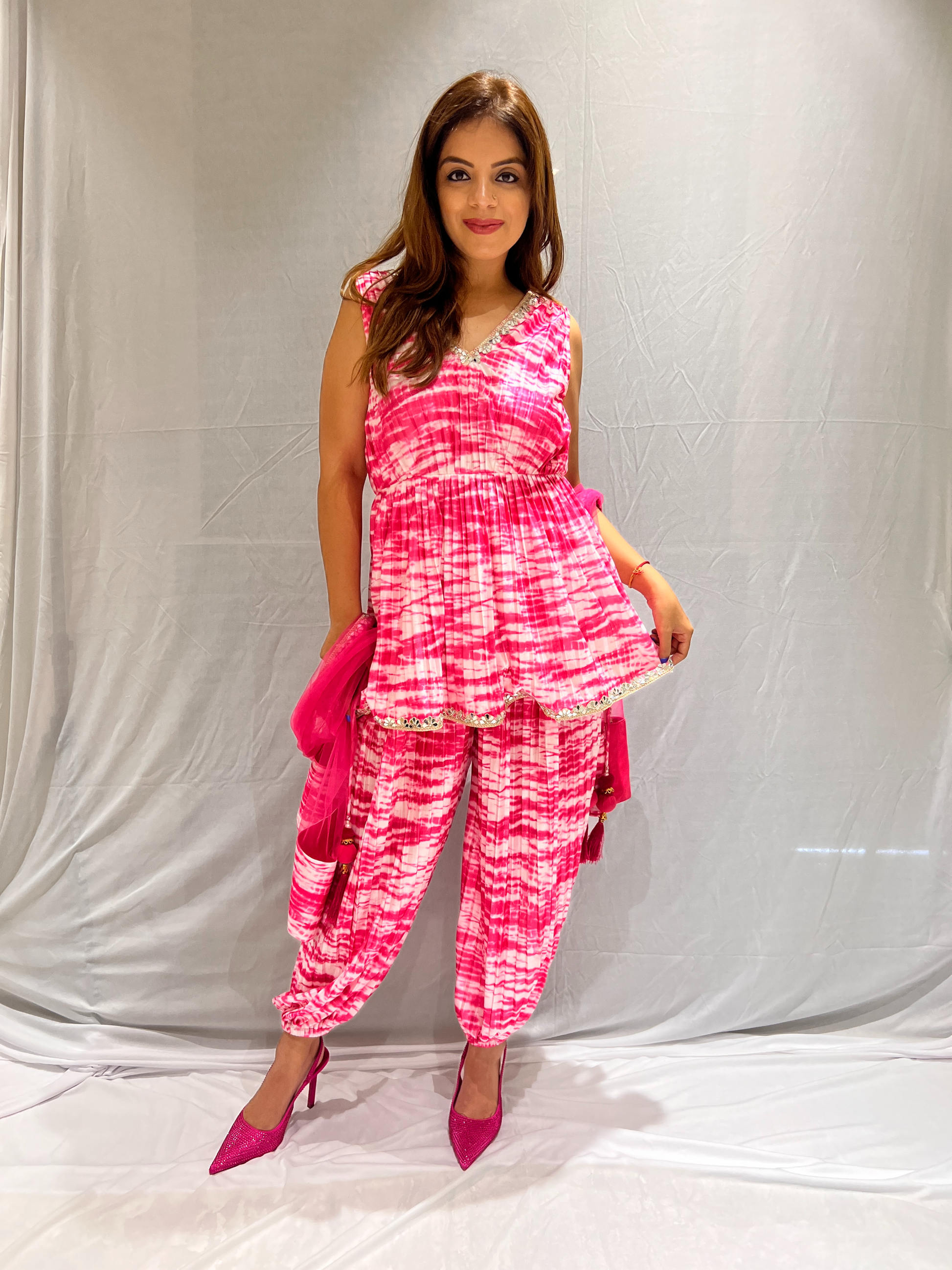 Elegant mirror lace pink and white tie-dye peplum set – modern design with intricate lace detailing for a chic, sophisticated look
