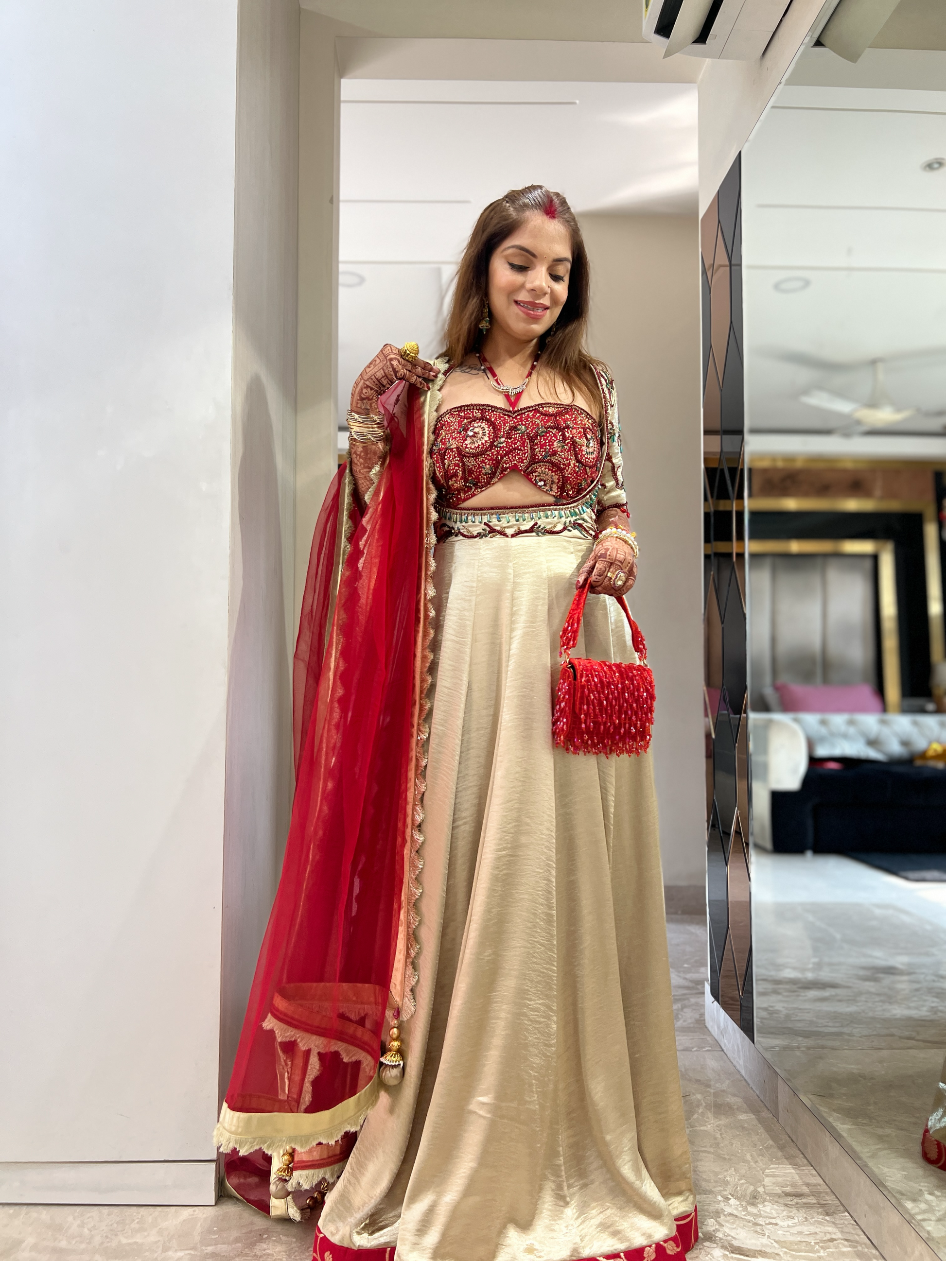 Elegant red and golden Anarkali with intricate embroidery – perfect for weddings and festive occasions