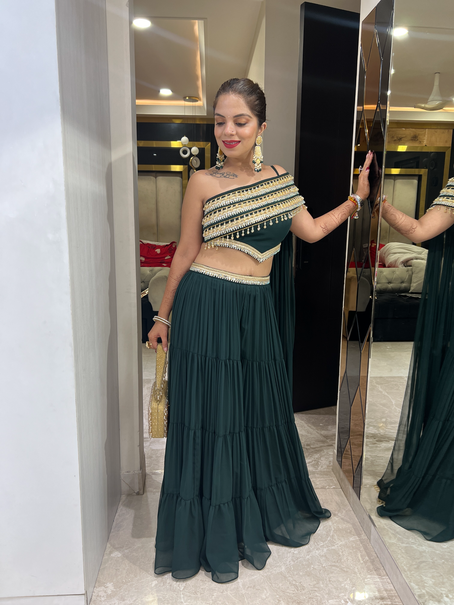Emerald green embellished layered sharara set with festive detailing – Indian celebration outfit for women