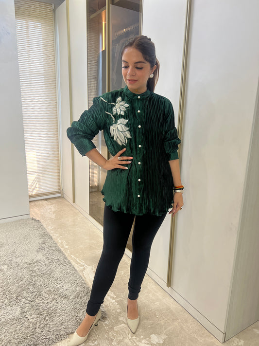 Front view of green pleated embroidered shirt for women