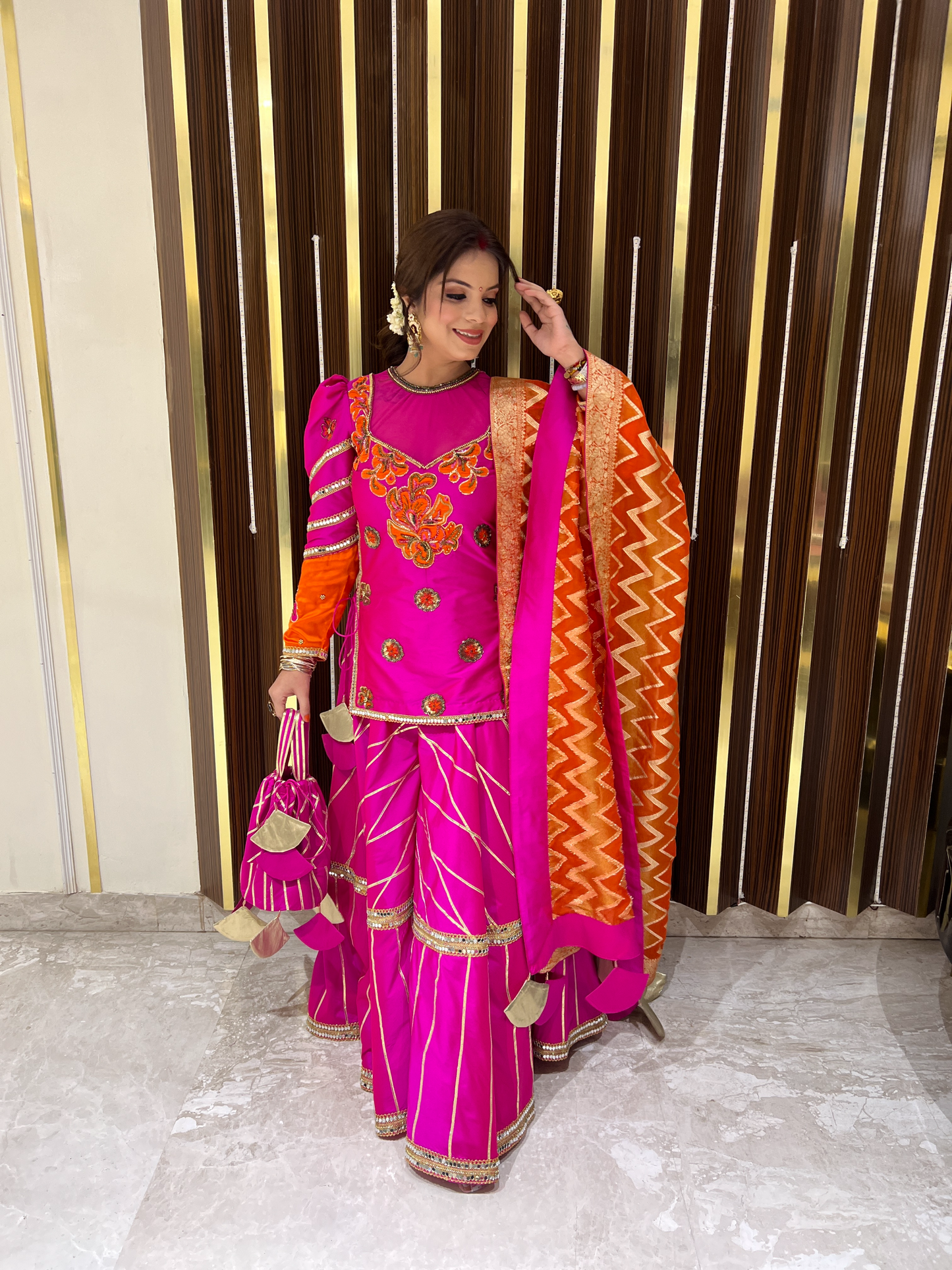 Model wearing glamorous embroidered sharara suit – perfect for sangeet and receptions