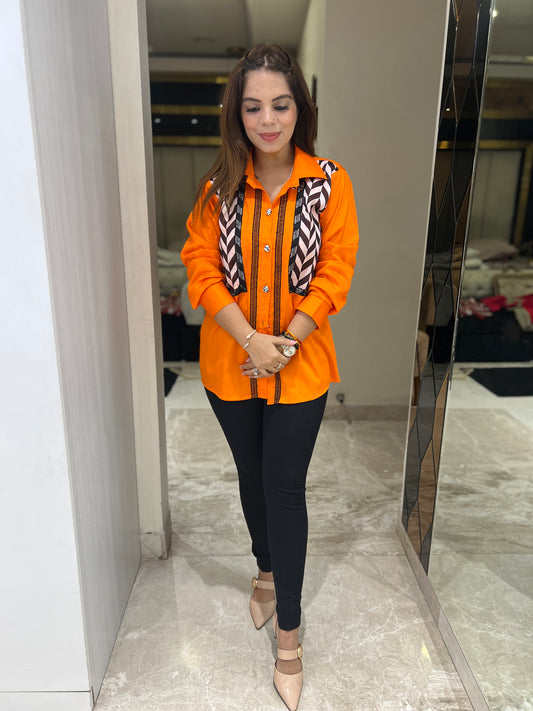 Bold orange button-up shirt for women with geometric panel design
