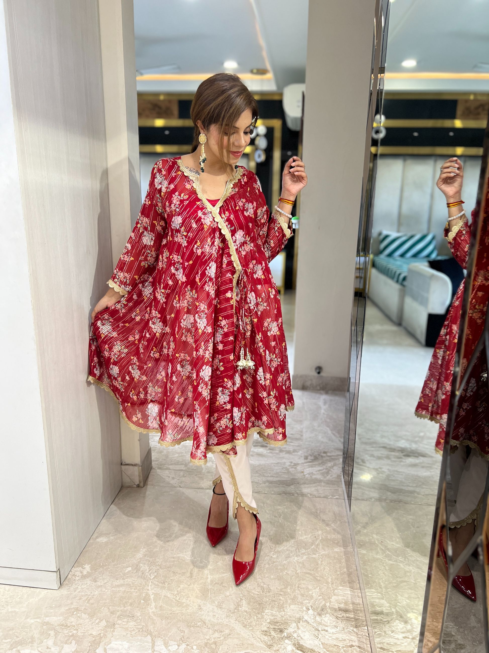 Festive red floral A-line Anarkali kurta with gold accents and cream pants – elegant Indian ethnic wear for women”