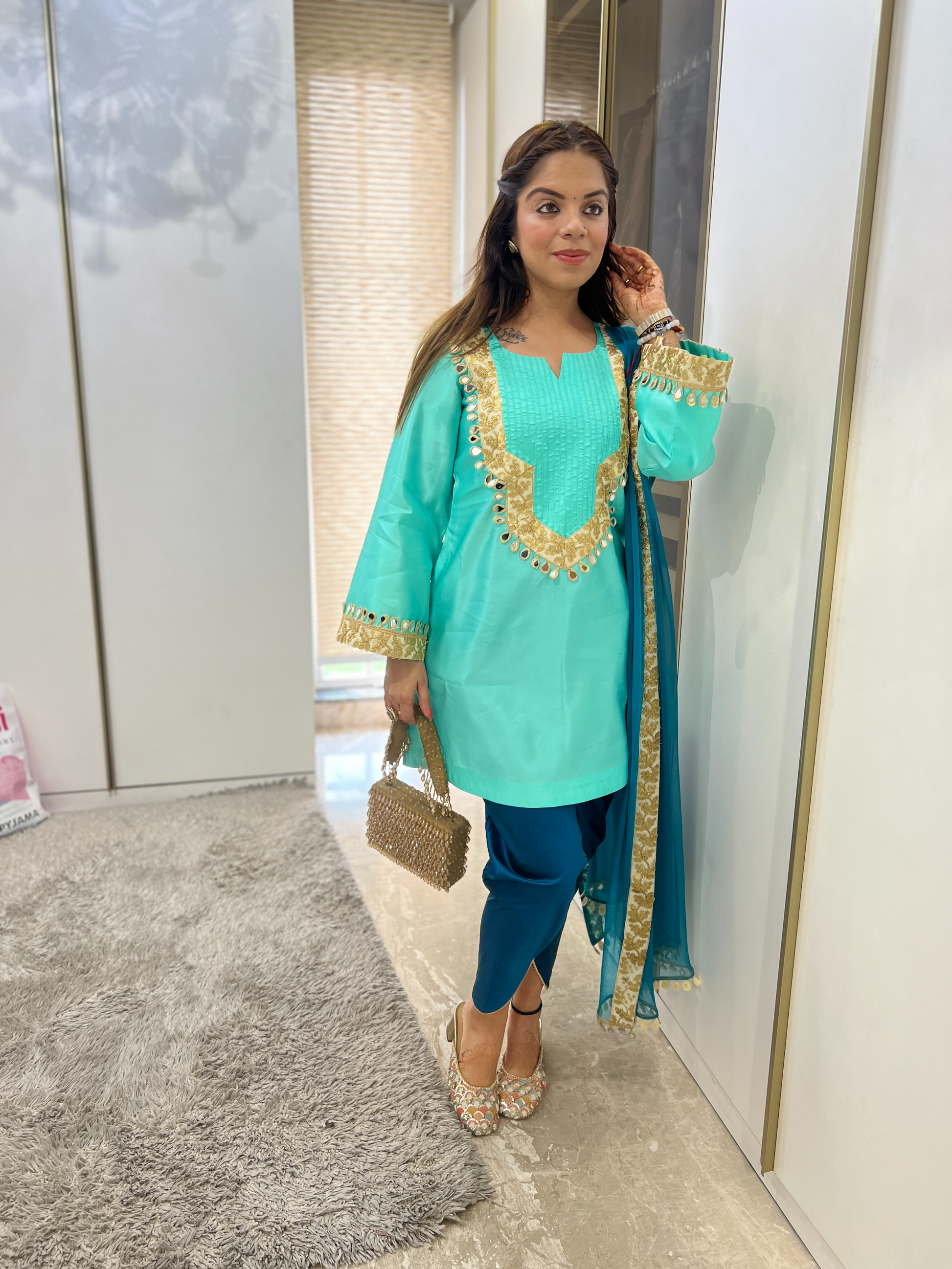 “Radiant turquoise mirror-work ensemble with sparkling embellishments – Indian festive outfit for women”
